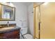 Bathroom boasts granite vanity, shower, and toilet at 207 W Clarendon Ave # 20B, Phoenix, AZ 85013