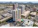 High rise building with pool and parking, aerial view of the surrounding city at 207 W Clarendon Ave # 20B, Phoenix, AZ 85013