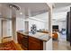 Open kitchen with granite counters and dark wood cabinets at 207 W Clarendon Ave # 20B, Phoenix, AZ 85013