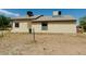 Rear view of a single-story house with a large backyard at 51631 W Turney Ln, Maricopa, AZ 85139