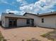 Rear view of house with patio and double doors at 51631 W Turney Ln, Maricopa, AZ 85139