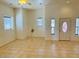 Bright living room with tile floors and neutral walls at 51631 W Turney Ln, Maricopa, AZ 85139
