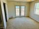 Bedroom with French doors leading to backyard access at 51631 W Turney Ln, Maricopa, AZ 85139