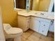 Bathroom with toilet and vanity with drawers at 51631 W Turney Ln, Maricopa, AZ 85139