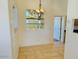 Dining area with tile floors and built-in shelving at 51631 W Turney Ln, Maricopa, AZ 85139