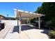 White pergola in backyard provides shade and enhances outdoor space at 18997 N 74Th Dr, Glendale, AZ 85308