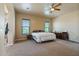 Large bedroom with ceiling fan and private access to bathroom at 32120 N 167Th Ave, Surprise, AZ 85387