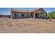 Home features a covered patio and spacious backyard at 32120 N 167Th Ave, Surprise, AZ 85387