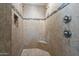 Large walk-in shower with dual shower heads and tiled seating at 32120 N 167Th Ave, Surprise, AZ 85387