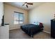 Bedroom with a full-size bed and ceiling fan at 32120 N 167Th Ave, Surprise, AZ 85387