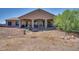 House with a large covered patio and a spacious backyard at 32120 N 167Th Ave, Surprise, AZ 85387
