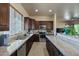 Modern kitchen with granite countertops and stainless steel appliances at 32120 N 167Th Ave, Surprise, AZ 85387