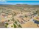 Aerial view of a desert residential community with mountain views at 32120 N 167Th Ave, Surprise, AZ 85387