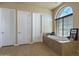 Bathroom with a large soaking tub and a window at 32120 N 167Th Ave, Surprise, AZ 85387