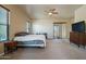 King-size bed in a spacious bedroom with sliding door access to patio at 32120 N 167Th Ave, Surprise, AZ 85387