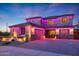 Two-story house with two-car garage and festive lights at 7088 W Redbird Rd, Peoria, AZ 85383