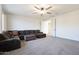 Spacious living room with sectional sofa and ceiling fan at 7088 W Redbird Rd, Peoria, AZ 85383