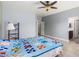 Bright bedroom with ceiling fan and tiled floors at 36029 N Mirandesa Dr, San Tan Valley, AZ 85143