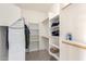 Spacious walk-in closet with shelving and rods at 36029 N Mirandesa Dr, San Tan Valley, AZ 85143