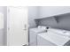 Laundry room with washer, dryer, and shelving at 36029 N Mirandesa Dr, San Tan Valley, AZ 85143