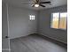 Bright bedroom with grey flooring and a window at 6134 S Borego Rd, Gold Canyon, AZ 85118