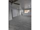 Spacious living room with gray vinyl flooring and ceiling fan at 6134 S Borego Rd, Gold Canyon, AZ 85118