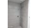 Grey tiled shower with a modern shower head at 6134 S Borego Rd, Gold Canyon, AZ 85118