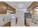 Kitchen with wood cabinets, stainless steel appliances, and tile floor at 1205 N 47Th Pl, Phoenix, AZ 85008