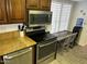 Kitchen with stove, microwave, and breakfast bar with seating at 5132 N 31St Way # 114, Phoenix, AZ 85016