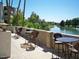 Relaxing patio area with lake views and wicker furniture at 5132 N 31St Way # 114, Phoenix, AZ 85016