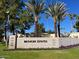 Biltmore Estates entrance with lush landscaping and palm trees at 5132 N 31St Way # 114, Phoenix, AZ 85016