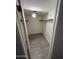 Walk-in closet with wood shelving and gray tile floor at 5132 N 31St Way # 114, Phoenix, AZ 85016