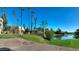 Community features a lake, lush landscaping, and palm trees at 5132 N 31St Way # 114, Phoenix, AZ 85016