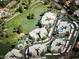 Aerial view showcasing the community's location near a lake and golf course at 5132 N 31St Way # 114, Phoenix, AZ 85016