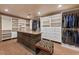 Spacious walk-in closet with custom built-ins and island at 10721 E La Junta Rd, Scottsdale, AZ 85255
