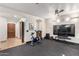 Home gym with stationary bike, weights, and large screen TV at 10721 E La Junta Rd, Scottsdale, AZ 85255
