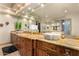 Bathroom with double vanity, stone countertops and large mirrors at 10721 E La Junta Rd, Scottsdale, AZ 85255