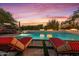 Inviting pool and spa with lounge chairs and fire features at 10721 E La Junta Rd, Scottsdale, AZ 85255