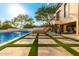 Relaxing pool area with lounge chairs and lush landscaping at 10721 E La Junta Rd, Scottsdale, AZ 85255
