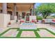 Relaxing fire pit area with seating and beautiful landscaping at 10721 E La Junta Rd, Scottsdale, AZ 85255