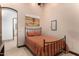 Small bedroom with a full-size bed and rustic decor at 10721 E La Junta Rd, Scottsdale, AZ 85255