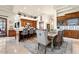 Open kitchen and dining area with island and bar seating at 10721 E La Junta Rd, Scottsdale, AZ 85255