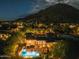 Luxury estate with a pool, and mountain views at sunset at 10721 E La Junta Rd, Scottsdale, AZ 85255