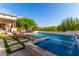 Inviting pool and spa with ample lounge space at 10721 E La Junta Rd, Scottsdale, AZ 85255