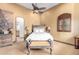 Cozy bedroom with a comfortable bed and a view of the bathroom at 10721 E La Junta Rd, Scottsdale, AZ 85255