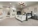Main bedroom with fireplace, large bed, and seating area at 10721 E La Junta Rd, Scottsdale, AZ 85255