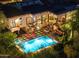 Luxury home with a sparkling pool, expansive patio, and solar panels at 10721 E La Junta Rd, Scottsdale, AZ 85255