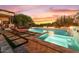 Stunning pool and spa area with a waterfall feature at 10721 E La Junta Rd, Scottsdale, AZ 85255
