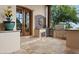 Outdoor kitchen with built-in grill and sunburst tile at 10721 E La Junta Rd, Scottsdale, AZ 85255