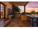Gorgeous outdoor kitchen with built-in grill and bar at 10721 E La Junta Rd, Scottsdale, AZ 85255